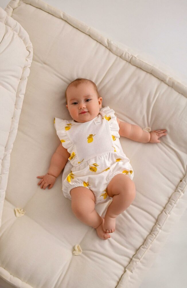 Rampers niemowlęcy ażurkowy słoneczne owocki - cytrynki (body)